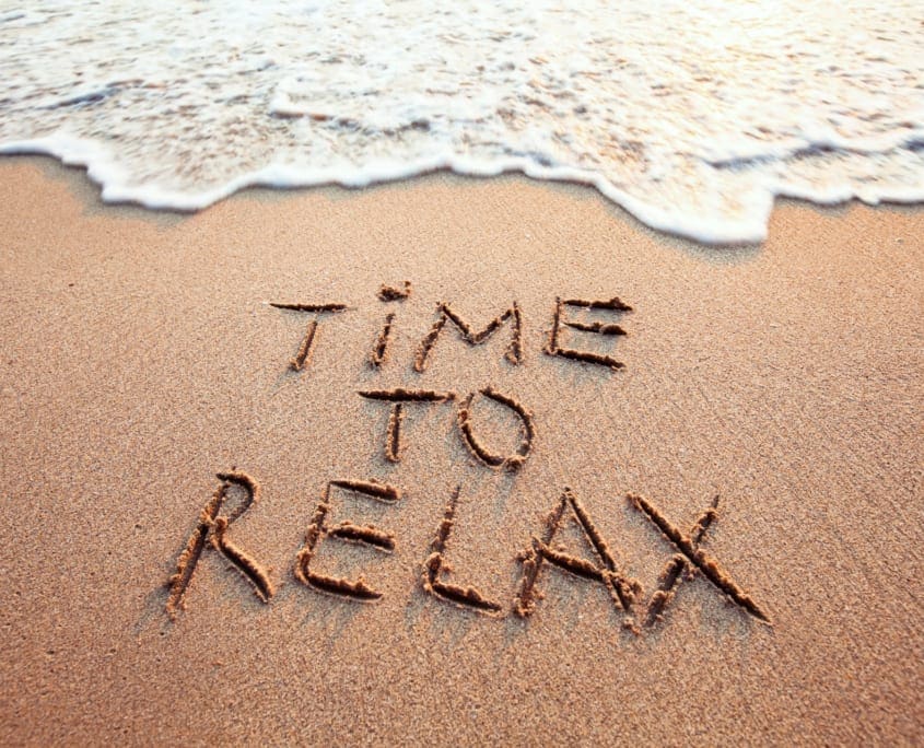 Hypnotherapy Services Melbourne - time to relax, concept written on sandy beach